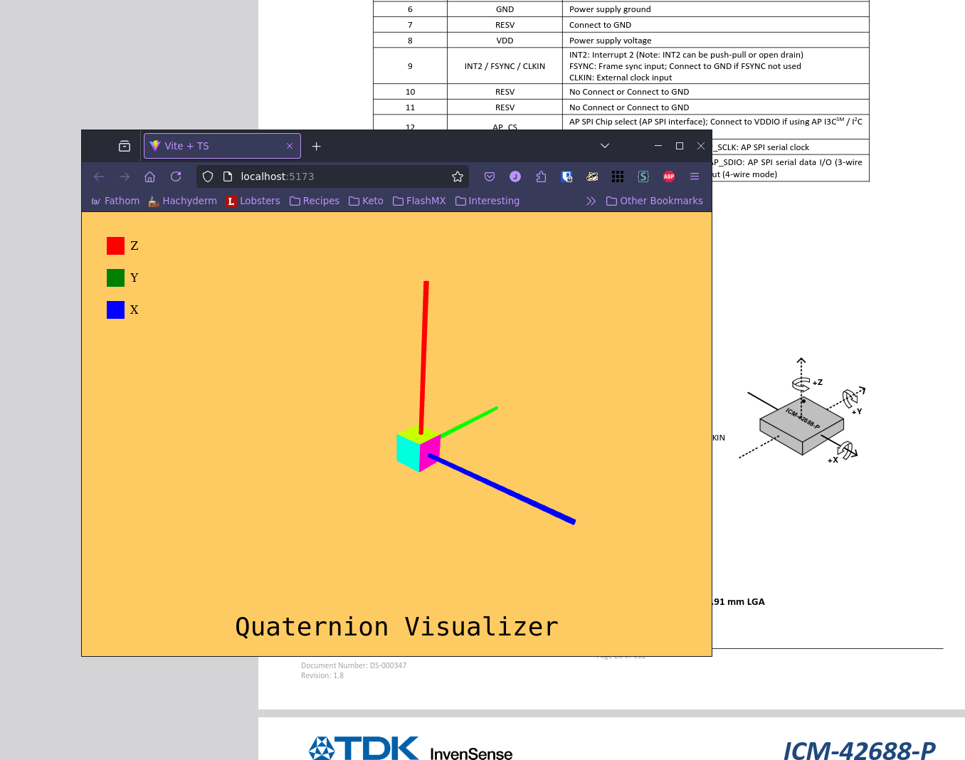 A 3d visualizer that shows a cube oriented with arrows for each axis. Behind it is a datasheet showing a similar cube.
